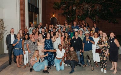Group photo of team and talents at a party